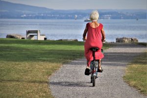 retiree woman riding a bike